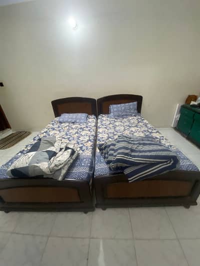 Two single beds wiith one wardrobe (three doors )