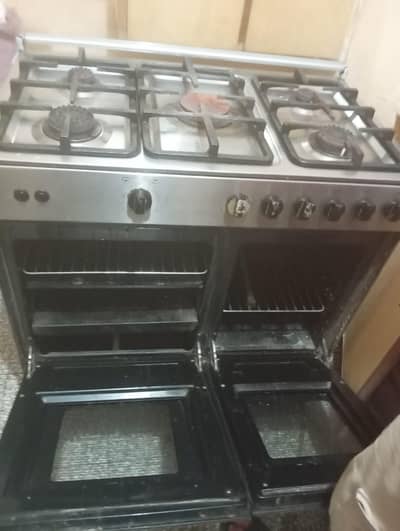 a stove with gas and electric oven