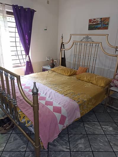 iron bed with side tables