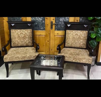 Wooden arm chairs (2 pieces) paired with table in neat condition