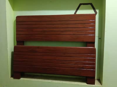 2 wooden single beds