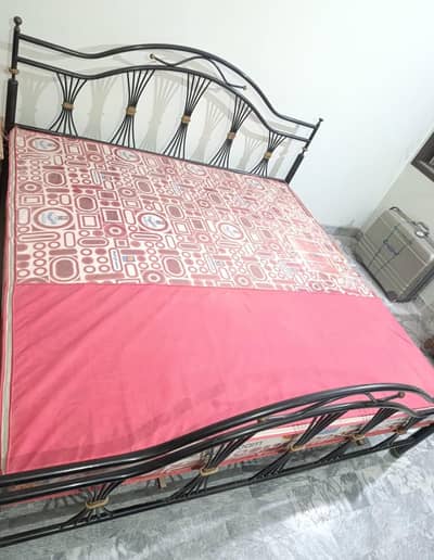 King size iron bed with dressing table available for sale.
