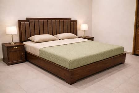 wooden bed with two side tables