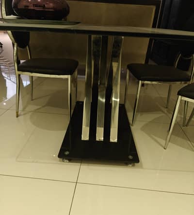 1 glass table for 6 and 6 chairs with black leatherite