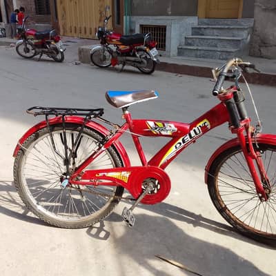 Red Deluxe Bicycle – Good Condition – Urgent Sale