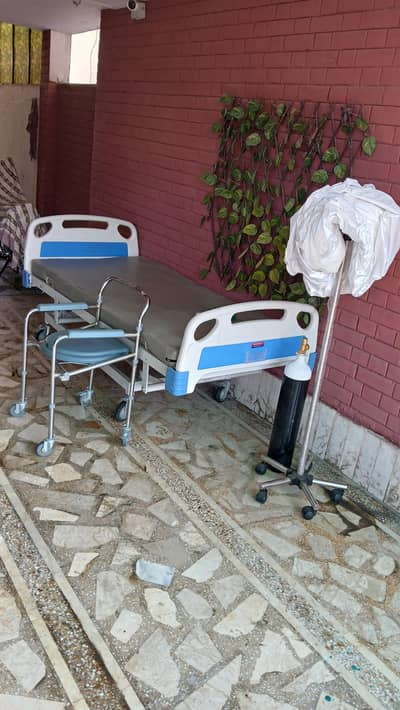Hospital patient bed with Bedside Commode Chair, Oxygen Cylinder & IV