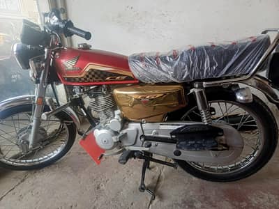 Lush gold Honda 125cc special edition for sale.
