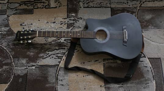 Kabat beginner acoustic guitar, bag, straps, capo, and extra strings