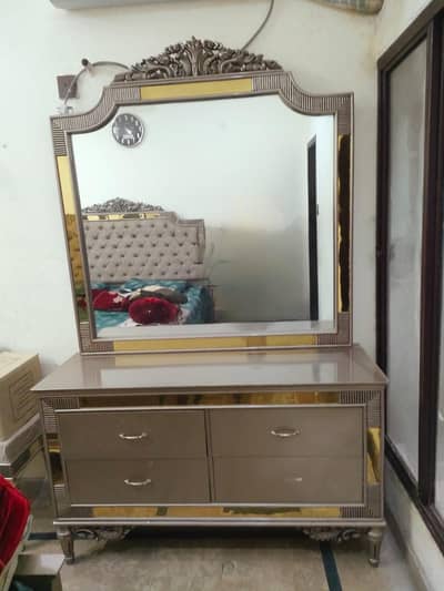 One King size bed with 2 side tables and dressing table