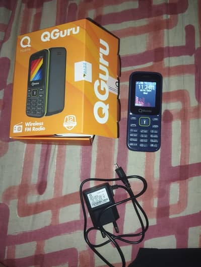 Q mobile with box and charger