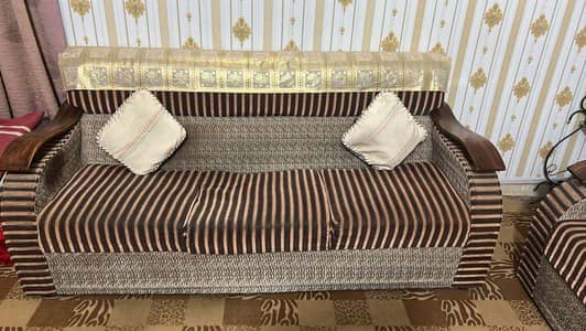 Urgent sale 7 seater wooden sofa set.