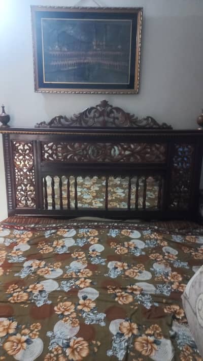 Wooden bed in brown Colour