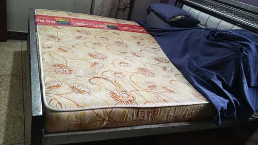 Hardly used. . . King size bed just with matress (packed in plastic)