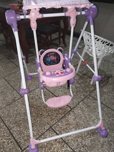 pink and purple baby swing