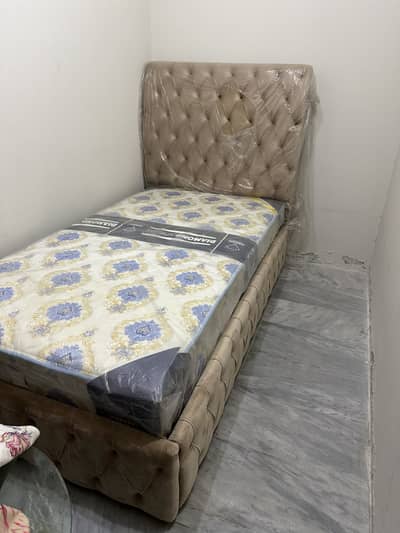 Single Cushioned Bed, 10/10 condition with brand new spring mattress.
