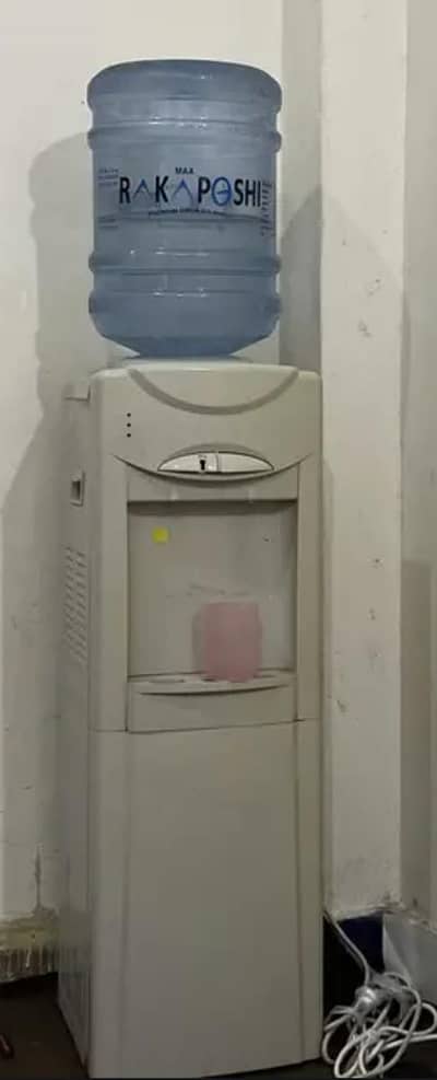 Water dispensor in good condition with both cold and hot along freedge