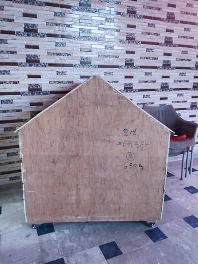 Wooden pet house with wheels for sale in very good condition