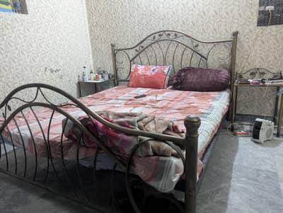 iron bed and side tables in very good condition