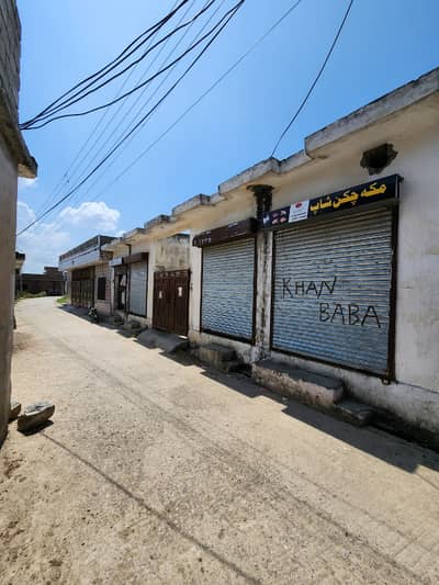 11 Marla Plot With 4 Shops Available For Sale On Gated Road Basti Wah Cantt