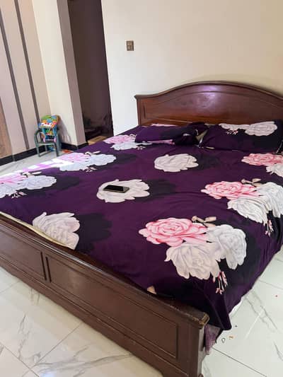 double bed with dressing mirror