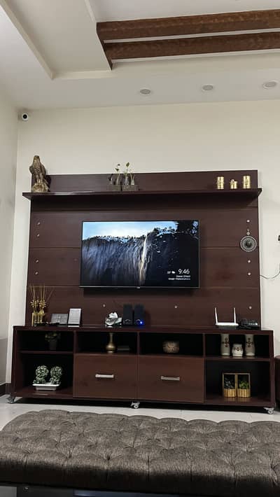 Wooden media wall with tv rack
