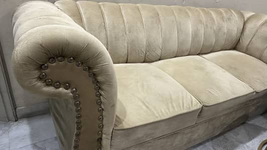 3 seater sofa in gold color