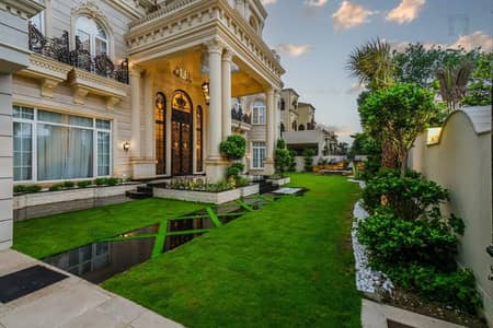 SPANISH DESIGN 2-KANAL ELEGANT AND FULLY MAINTAINED SUPER HOT LOCATED BUNGALOW IS AVAILABLE IN THE BEST BLOCK OF DHA LAHORE. (1-KANAL LAWN)