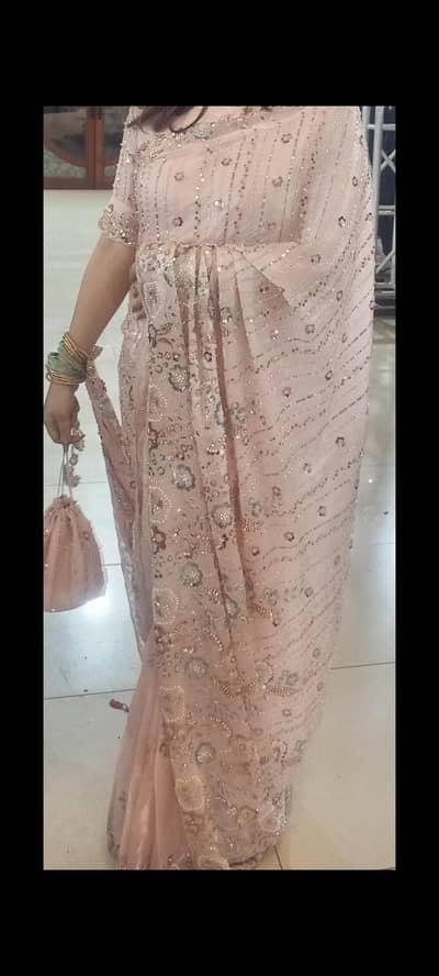 handwork saree with potli