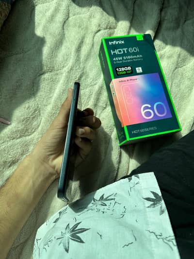 Infinix hot 60i.       6/128.11 month warranty.     with box