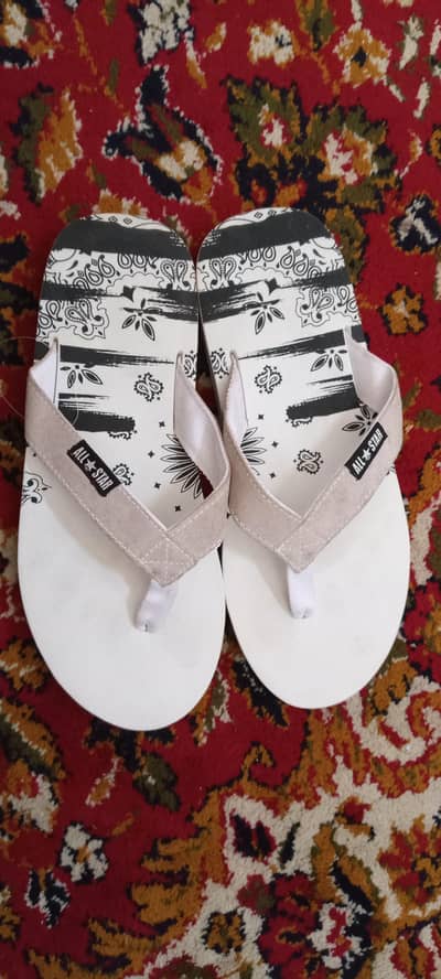 Selling Converse white slippers