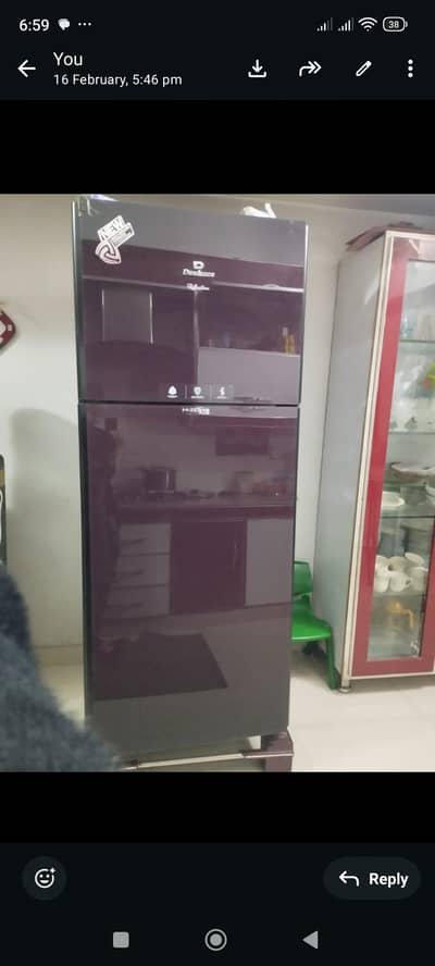 Full Size Dawlance Refrigerator with glass doors.