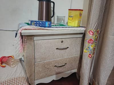 bed with dressing table and side tables