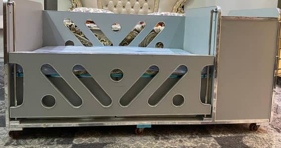 Baby Cot with tyres and Drawers