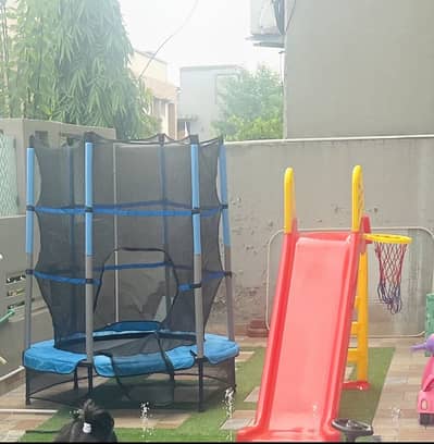 Trampoline with slide