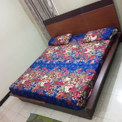 double bed with side table
