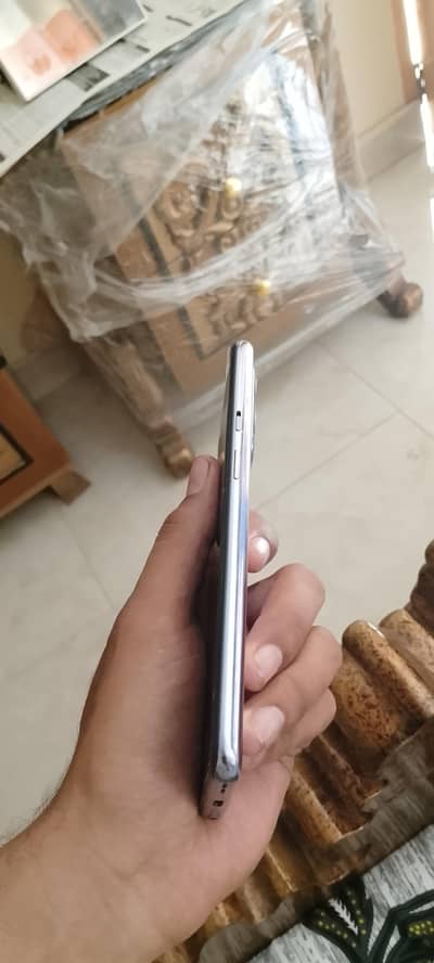 Female hand use One Plus 9