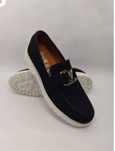 man's black casual loafers with lv logo