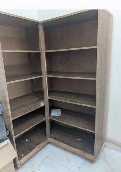 corner cupboard for books decorations and kitchen utensils