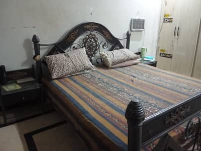 King size bed with two side tables and medicated mattress