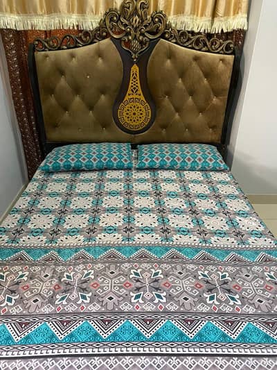 Queen size bed with 2 door cupboard and a dressing table