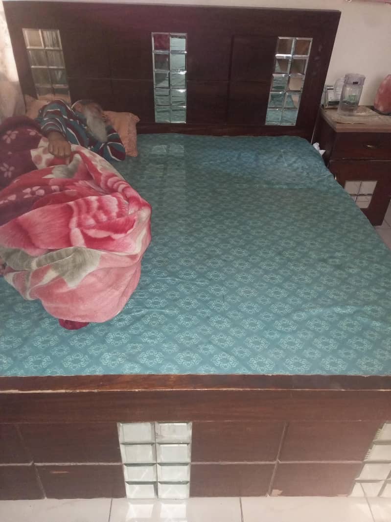 Bed without mattress and one side table 0