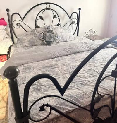 Queen size bed with side tables and dressing table