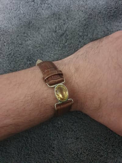 original citrine stone  with pure silver holder and leather strap