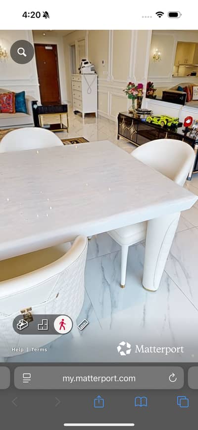 Marble table and white chairs