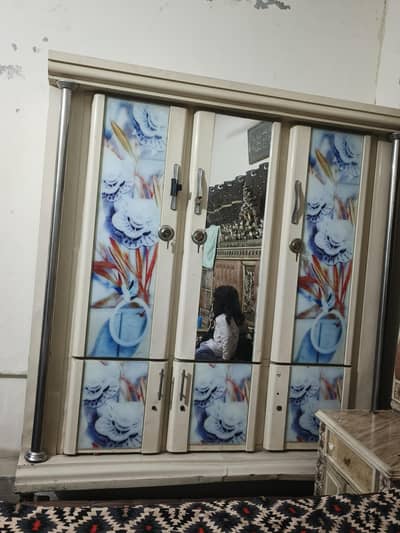 urgent sale 3 doors iron almirah with movable wheels