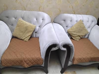 7 seater sofa with central table and seats covers.