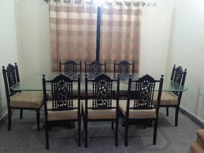 8 seater wooden dining table with glass top