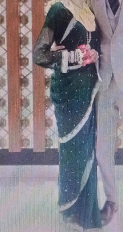 bottle green colour Saaree with beautiful golden work