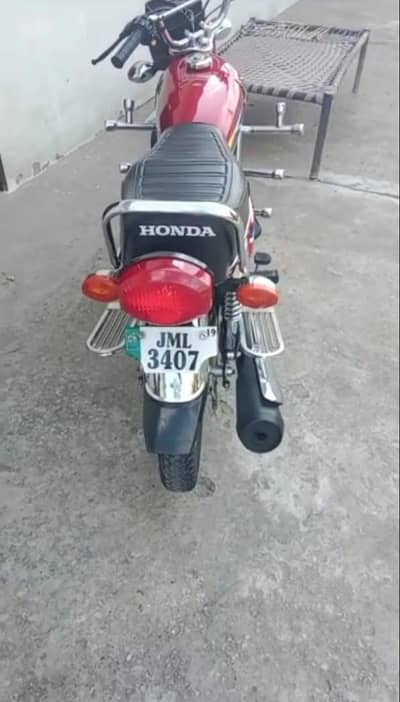 Honda 125 CG bike 2019 model jhelam ka number 03.29. 20.79. 08.3.