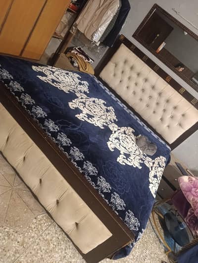 double bed with side table.